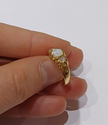 Lot 23 - An Opal and Diamond Three Stone Ring, the...