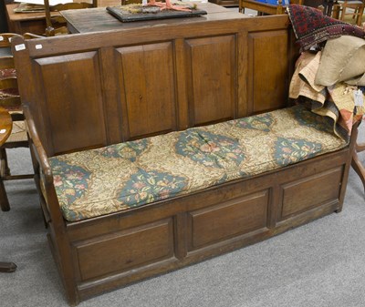 Lot 1303 - An 18th Century Oak Four Panel Box Settle,...