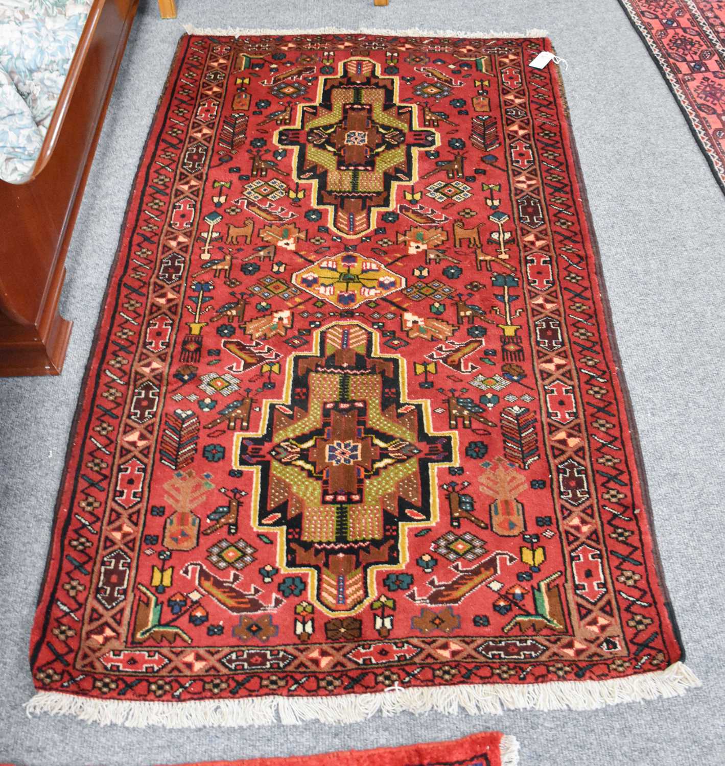 Lot 1213 - Baluch Rug, the raspberry field with two