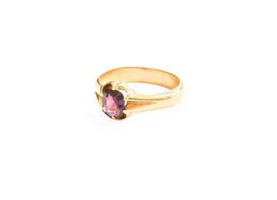 Lot 337 - A Garnet Ring, the oval cut garnet in a yellow...