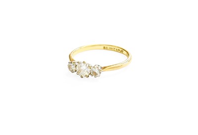 Lot 349 - A Diamond Three Stone Ring, the graduated...