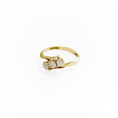 Lot 327 - A Diamond Three Stone Twist Ring, the old cut...