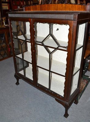 Lot 961 - An early 20th century mahogany china cabinet with double astragal glazed doors, shelved interior on