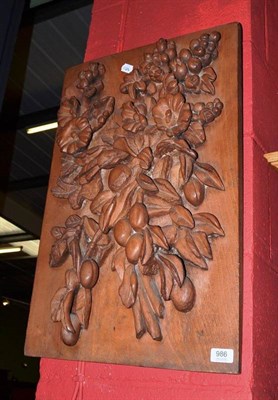 Lot 986 - A wooden panel carved with fruit and flowers