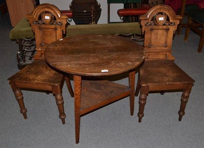 Lot 1004 - Oak cricket table and a pair of Victorian oak hall chairs