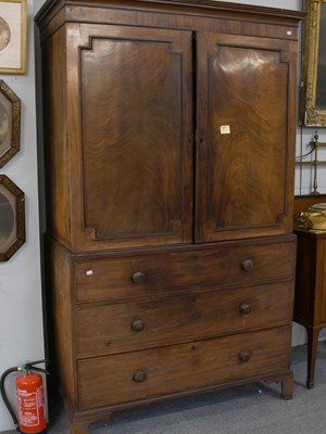 Lot 1277 - A George III Mahogany Linen Press, fitted with...