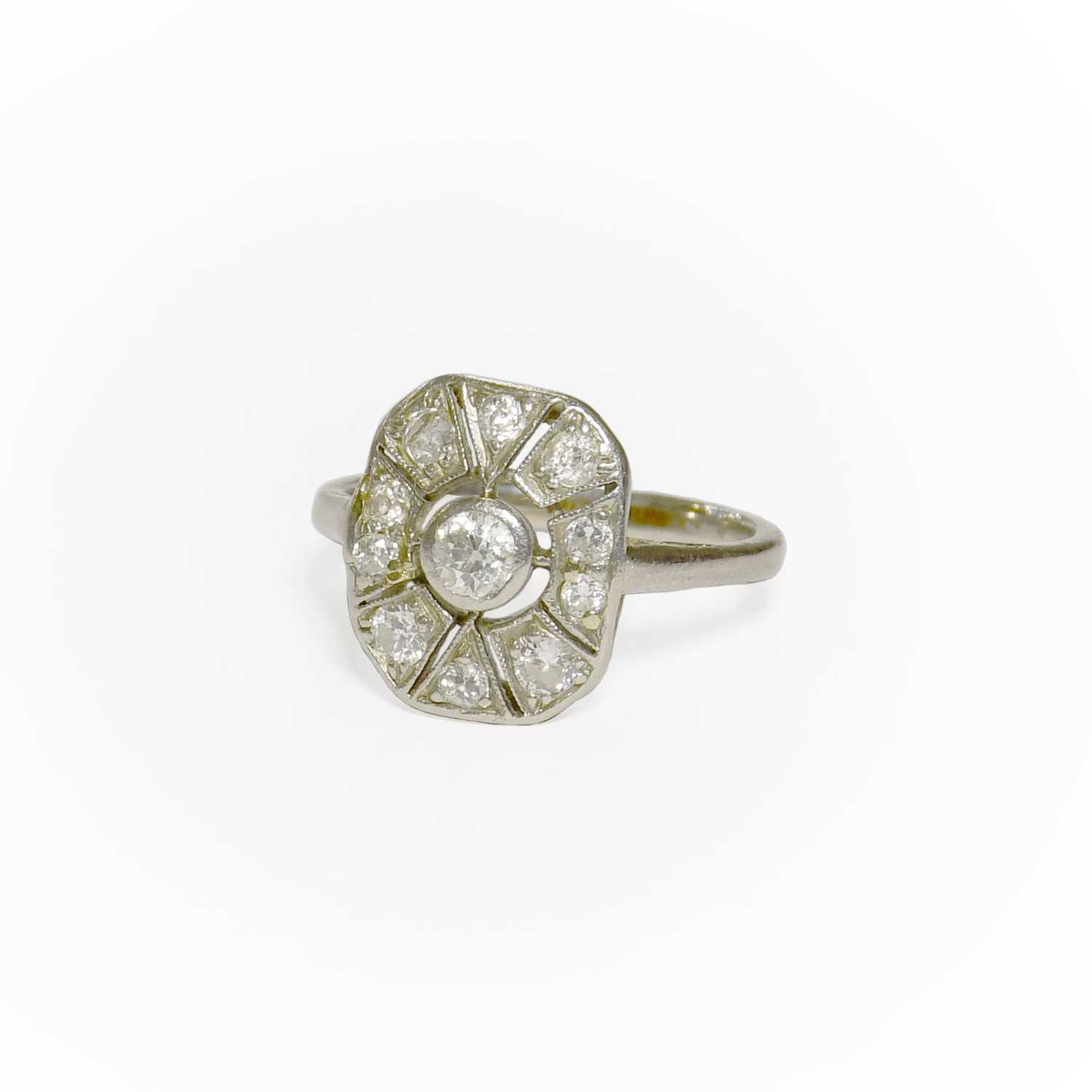 Lot 34 - A Diamond Ring, the rectangular pierced plaque...