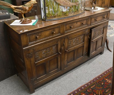 Lot 1307 - A Titchmarsh & Goodwin Style Oak Dresser Base,...