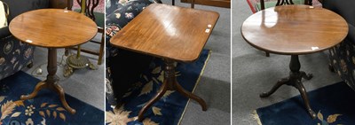 Lot 1288 - Three George Mahogany Tilt-Top Tripod Tables,...