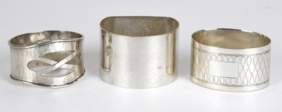 Lot 94 - Three Various Elizabeth II Silver Napkin-Rings,...