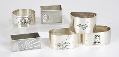 Lot 50 - Six Assorted Silver Napkin-Rings, one applied...