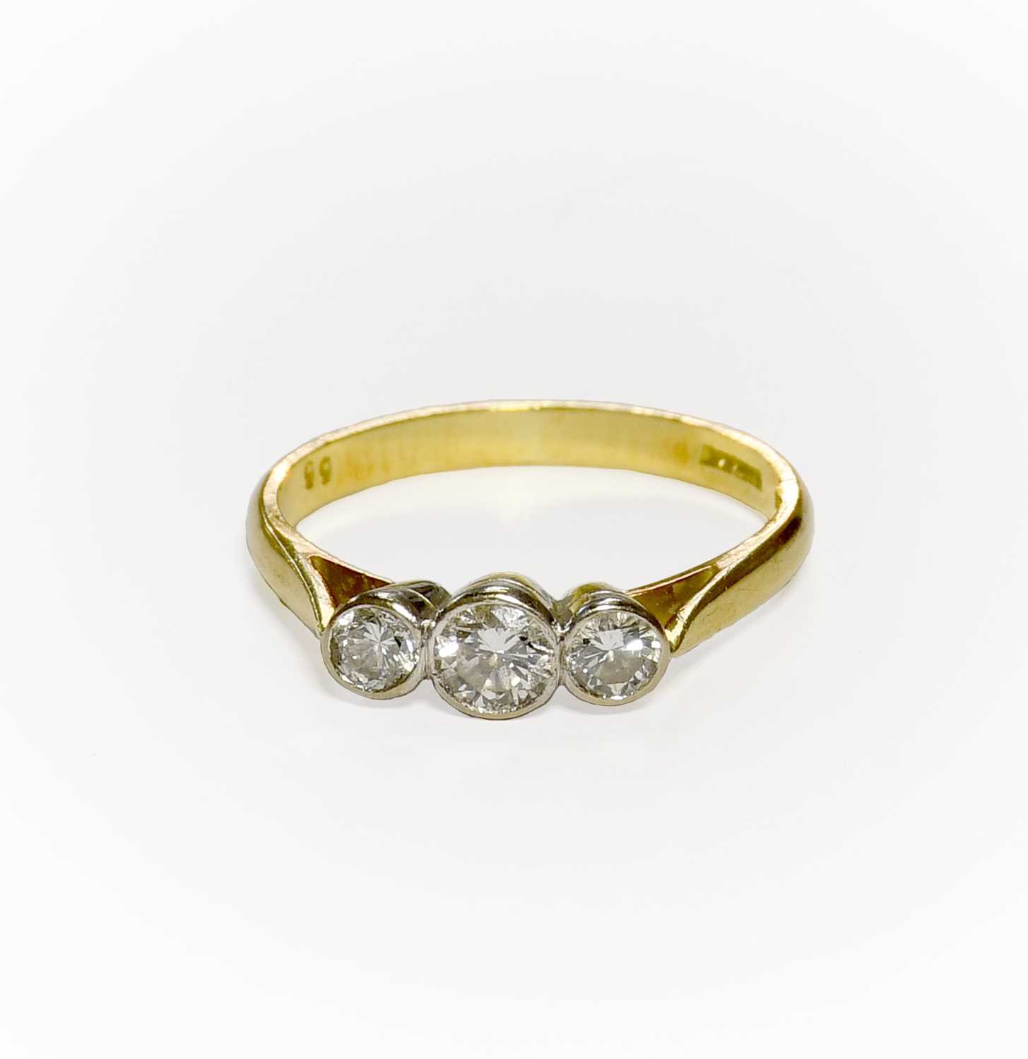 Lot 54 - An 18 Carat Gold Diamond Three Stone Ring, the...