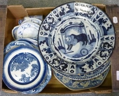 Lot 1081 - Two 18th century delft chargers, one decorated with a lion and a quantity of blue and white...