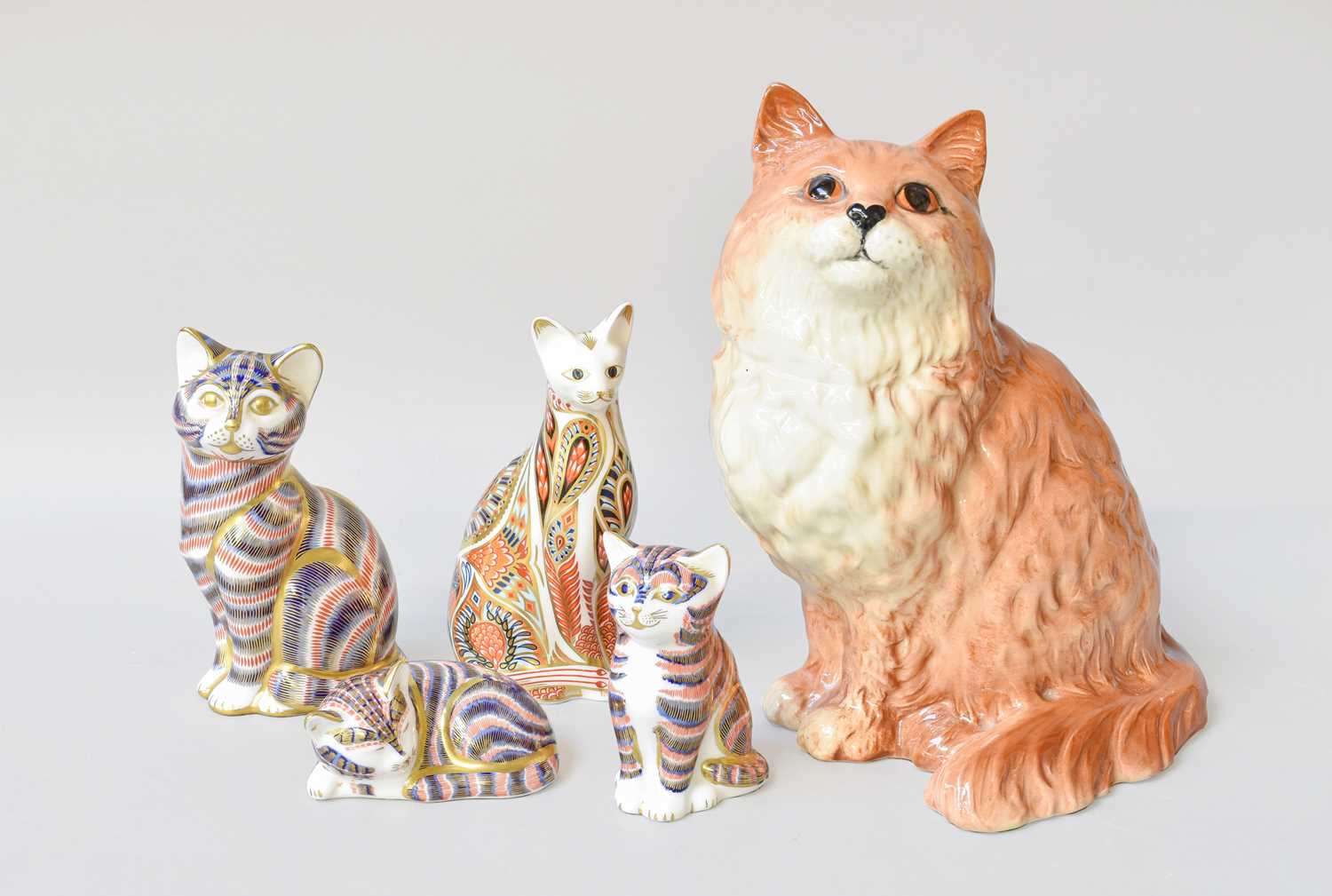 Lot 144 - Four Royal Crown Derby Porcelain Paperweights,...