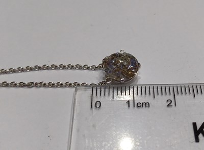 Lot 2221 - A Diamond Solitaire Necklace the round...