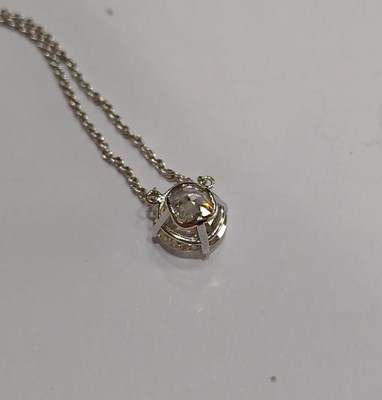 Lot 2221 - A Diamond Solitaire Necklace the round...