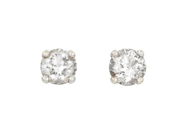 Lot 2294 - A Pair of Diamond Solitaire Earrings the round...