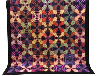 Lot 2092 - A Modern Patchwork Quilt comprising brightly...