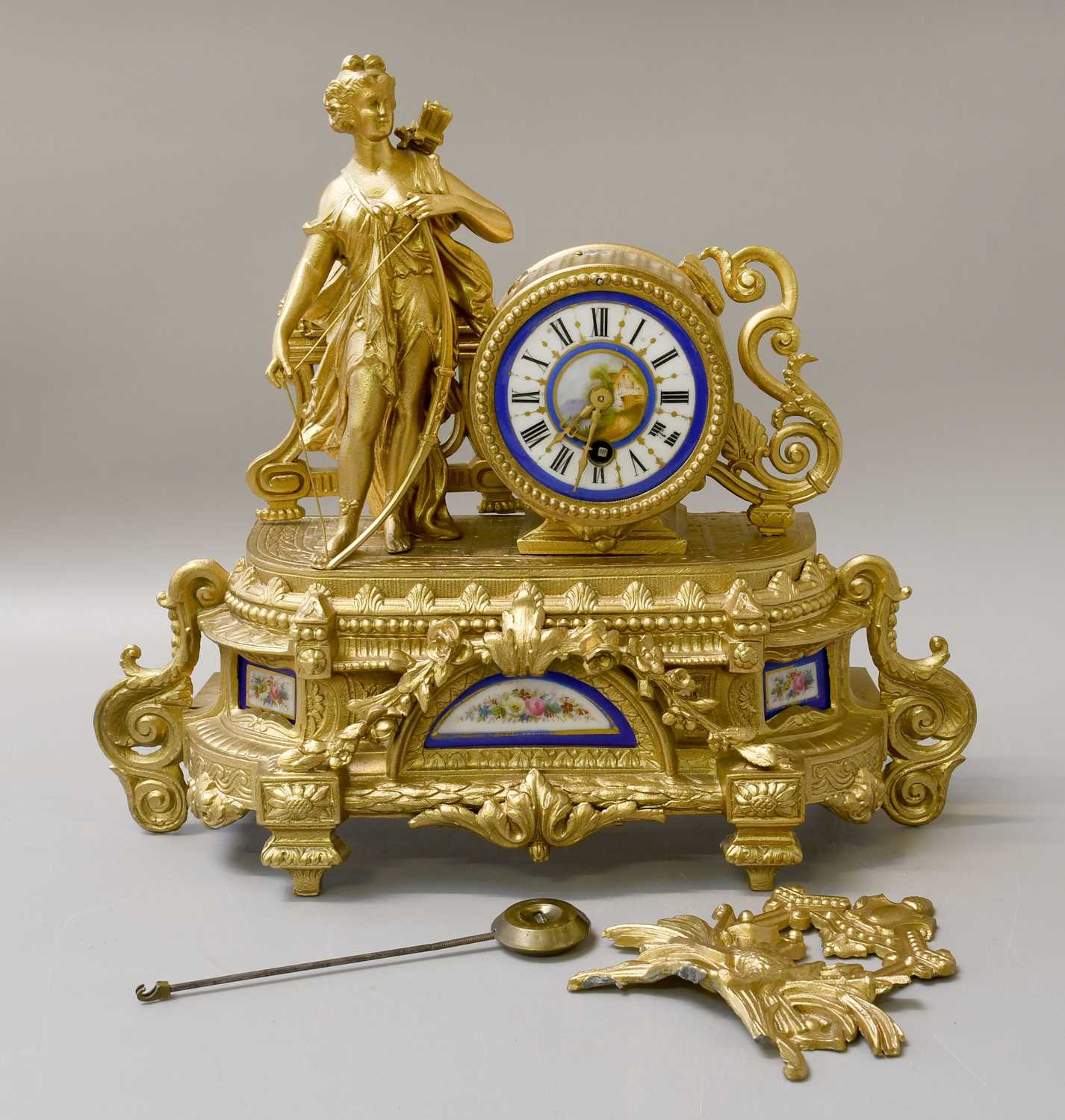 Lot 165 - A French Gilt Metal Porcelain Mounted Mantel...