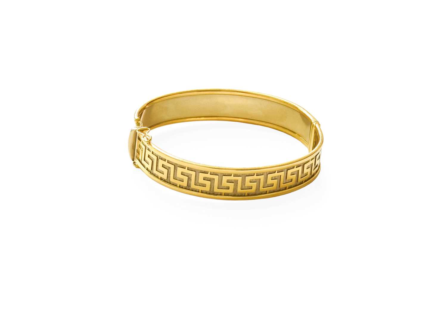 Lot 82 - A Greek Key Motif Hinged Bangle, stamped '750',...