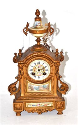 Lot 15 - A gilt metal and porcelain mounted striking mantel clock