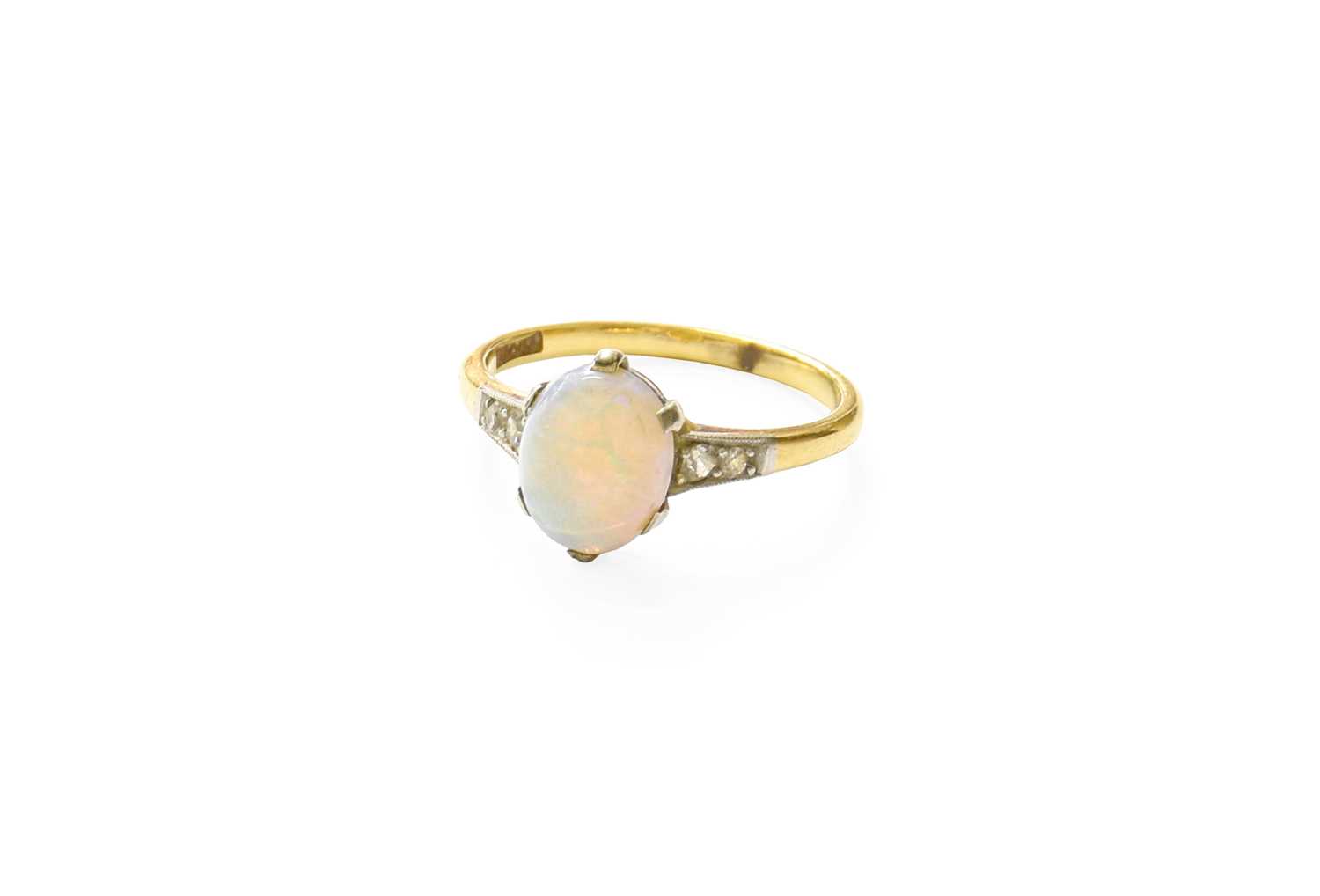 Lot 73 - An Opal Ring, the oval cabochon opal in a...