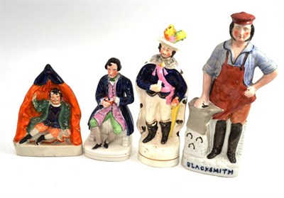 Lot 19 - A Staffordshire figure 'Blacksmith' and three others
