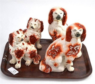 Lot 23 - Pair of 19th century pottery spaniels and pair of Staffordshire dogs (4)