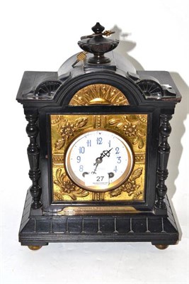 Lot 27 - A Victorian ebonised mantel clock, by J.W.Benson, with plaque 'PRESENTED TO MISS CONSTANTINE BY THE