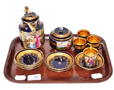 Lot 30 - A Vienna style porcelain coffee service, circa 1900, decorated with classical figures on a blue...