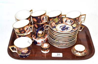 Lot 31 - A set of eleven Royal Crown Derby Imari pattern coffee cups and saucers, a similar miniature...