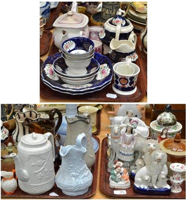 Lot 35 - Staffordshire figures, Victorian relief moulded mugs, tobacco jars, lustre decorated tea wares...