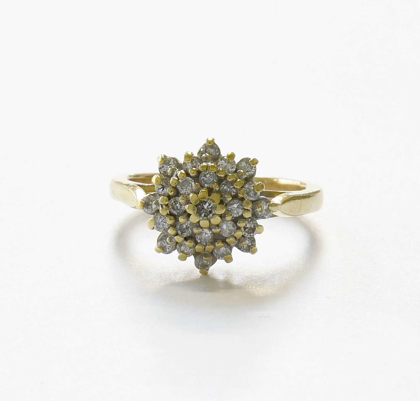 Lot 66 - A Diamond Cluster Ring, set throughout with...