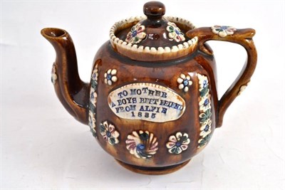 Lot 72 - Measham teapot, inscribed 'TO MOTHER A BOYS BEST FRIEND FROM ALFIE 1885'