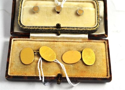 Lot 88 - A pair of cufflinks, stamped '18ct' and a set of three collar studs, stamped '9ct' in an Asprey box