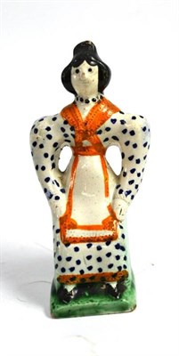 Lot 93 - 19th century Yorkshire pearlware figure of a seated woman in a spotty dress