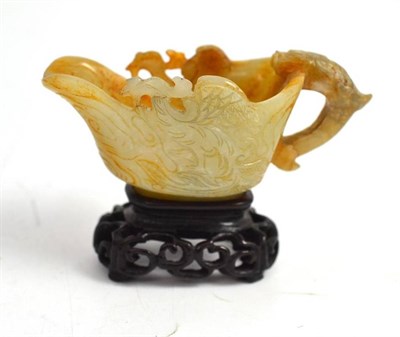 Lot 96 - A Chinese jade type small jug on stand