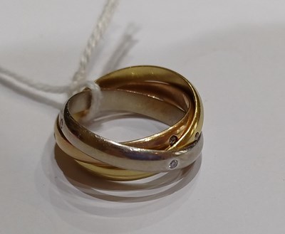 Lot 2250 - A Diamond Trinity Ring, by Cartier comprising...