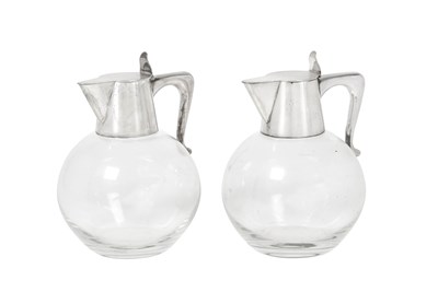 Lot 2088 - A Pair of Danish Silver-Mounted Glass Claret-Jugs