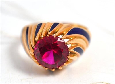 Lot 114 - An enamelled and synthetic ruby set dress ring