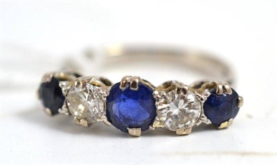 Lot 128 - Five stone diamond and sapphire ring