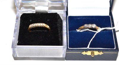 Lot 131 - An 18ct gold three stone diamond ring and a seven stone diamond ring (2)