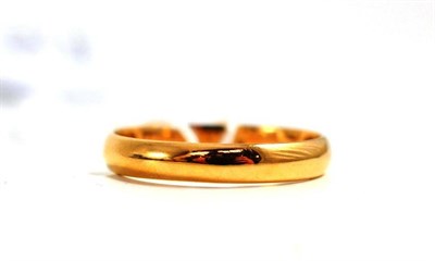 Lot 134 - An 18ct gold band ring