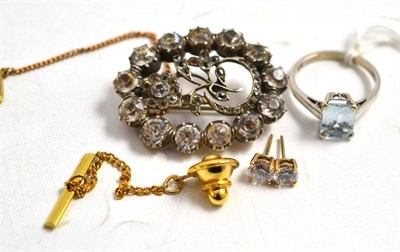 Lot 135 - A paste brooch, an aquamarine ring, a pair of earrings and a tie pin