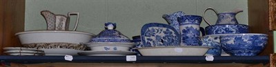 Lot 145 - A shelf of blue and white pottery including jugs and bowls, drainer, etc