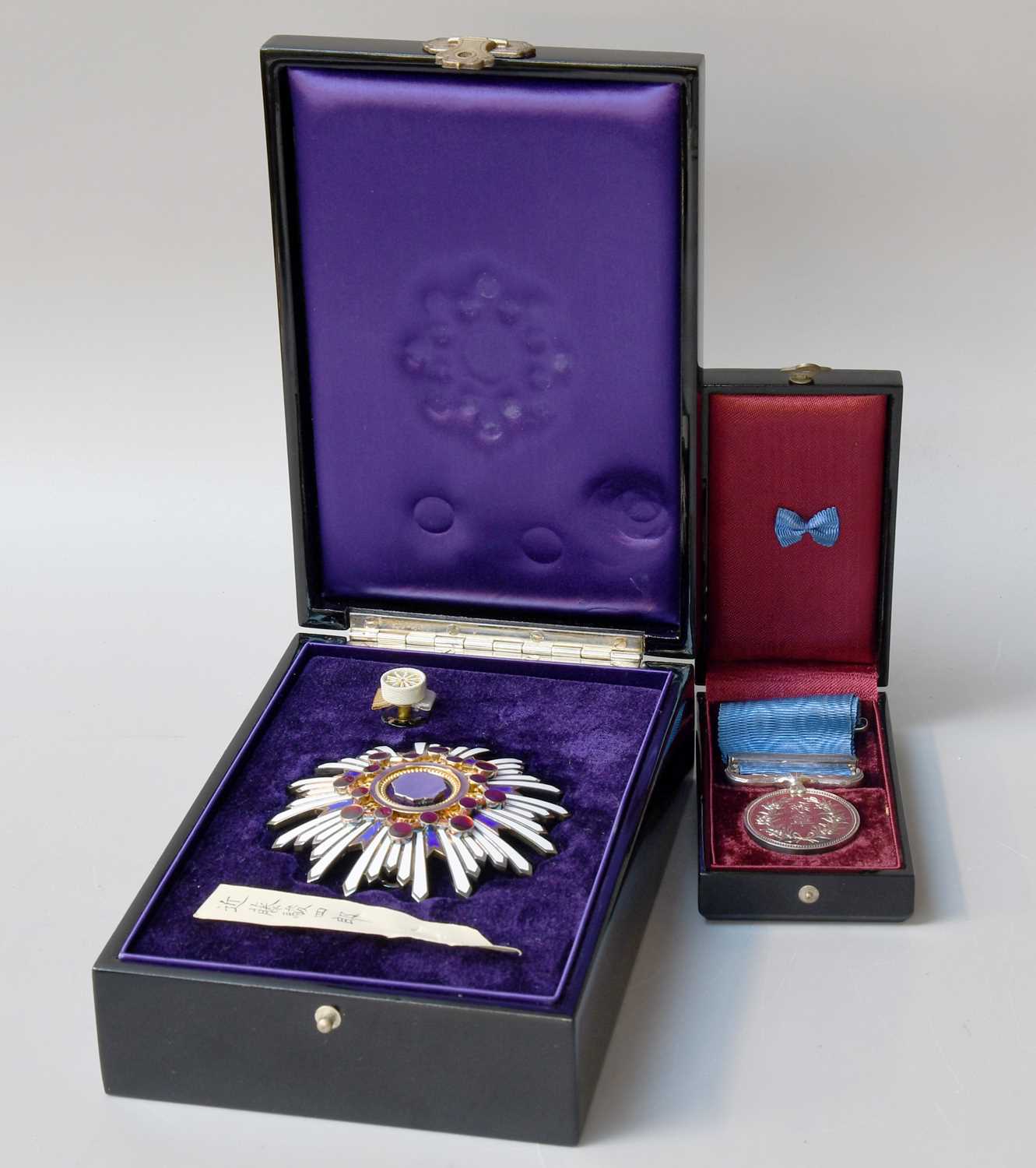 Lot 211 - A Japanese Enamel Medal ''Order of the Sacred...