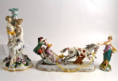 Lot 168 - A Dresden figural group of a lady and gentleman on a sleigh, a Continental figural candlestick...