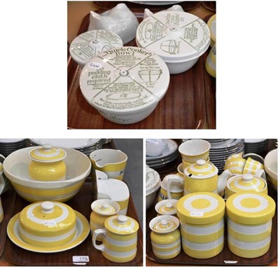 Lot 179 - Two trays of Cornish yellow banded kitchen wares, three quick cooker bowls and two Greens moulds