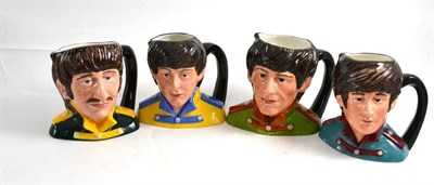 Lot 182 - Four Royal Doulton character jugs depicting The Beatles
