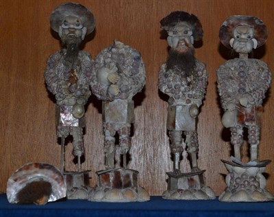 Lot 194 - Japanese interest: A rare set of four seashell encrusted figures of bearded fishermen, probably...